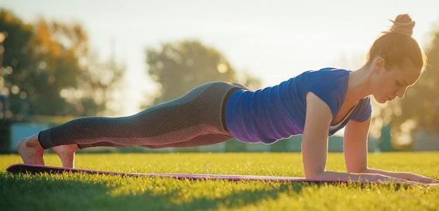 fit woman doing plank