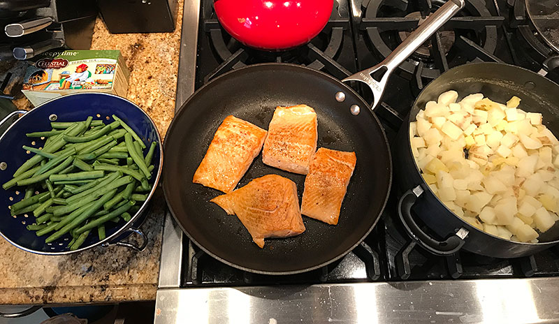 home chef cooking salmon dinner
